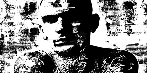 Male tattooed torso facing forward against textured wall