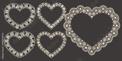 Intricate heart shaped frames with ornamental detailing on a dark background