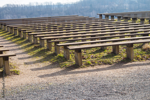 Benches for summer concerts on the grounds of the old castle ruins. European touristic sightseeing of Estonia