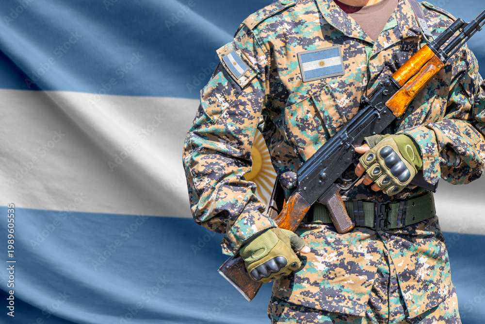 Fototapeta premium Argentina flag with soldier holding assault rifle