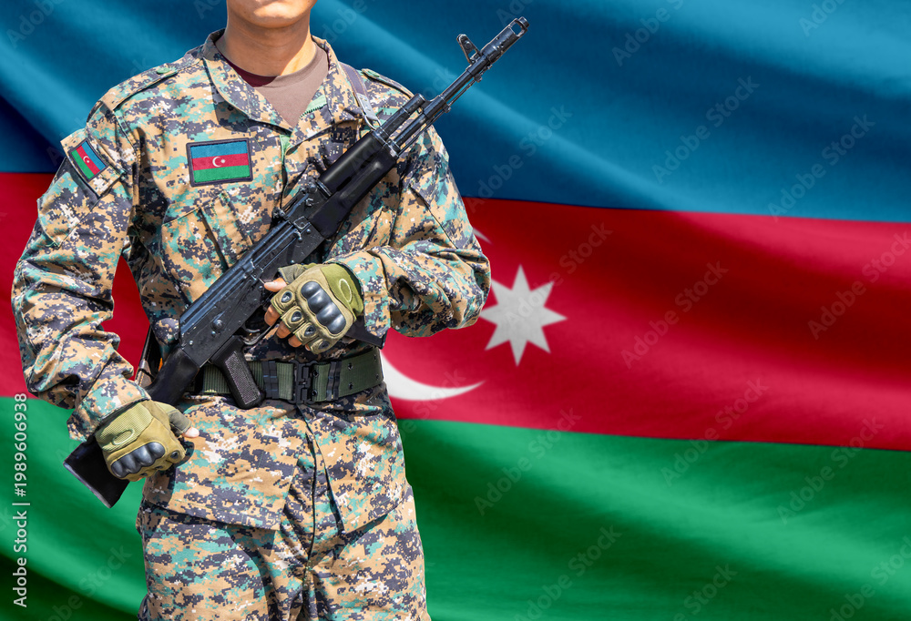 Obraz premium Azerbaijan flag with soldier holding assault rifle