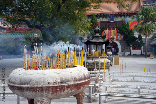 Canvas Print Incense sticks burning in a large ceremonial urn at Po Lin Monastery on Lantau Island, Hong Kong