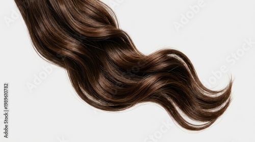 A long, wavy strand of brown hair, likely female, flowing gracefully against a white background.
