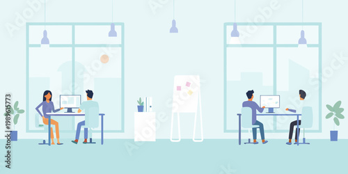 Modern office space with employees working at desks near large windows