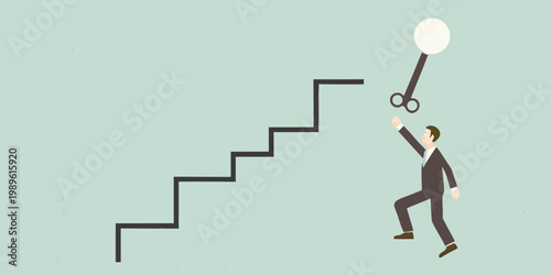 Man reaching for a key on a string above a staircase