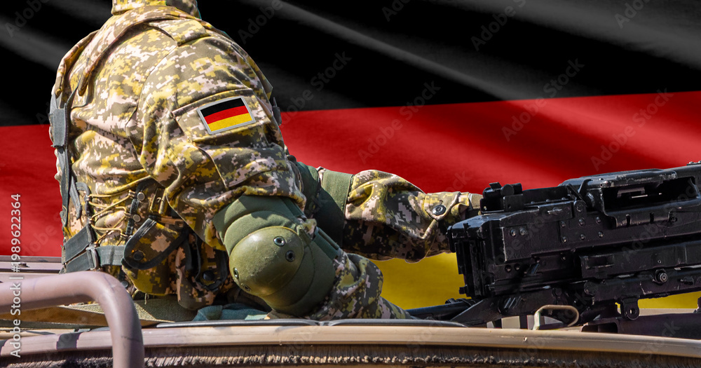 Obraz premium Germany flag with soldier at machinegun turret