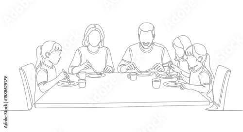 Family sitting around dinner table eating.