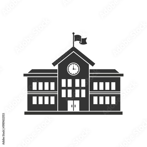 A school building stands with a clock tower and flag on top