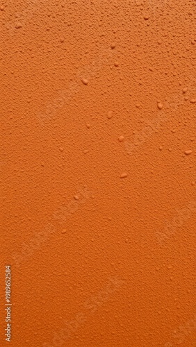 Captivating Vibrant Orange Surface with Texture and Water Droplets: A Visual Exploration of Color and Design Elements for Creative Inspiration