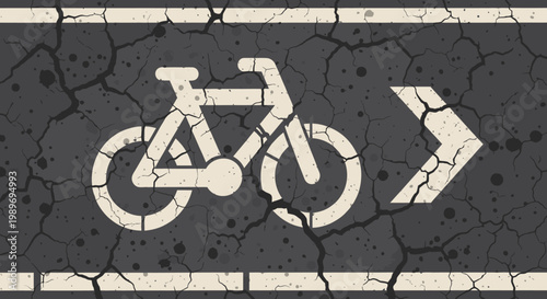 Distressed White Bicycle Lane Symbol with Arrow on Cracked Dark Asphalt Road Surface