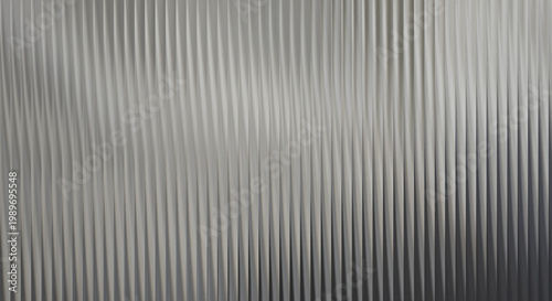 Canvastavla A close-up view of a metallic surface with vertical ridges and a gradient of gra
