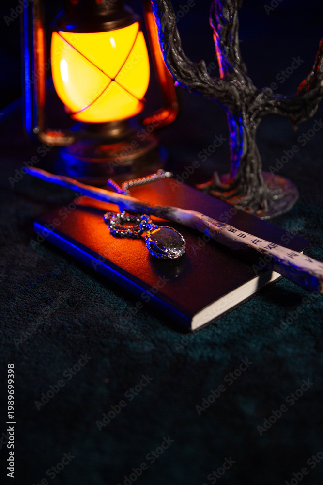 Fototapeta premium Magical artifacts lie under the light of an lamp