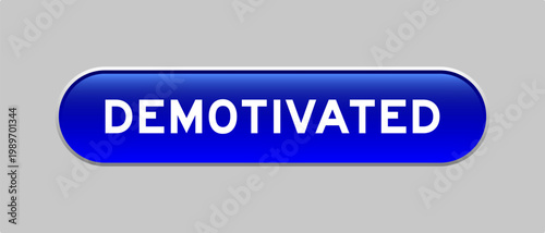Blue color capsule shape button with word demotivated on gray background