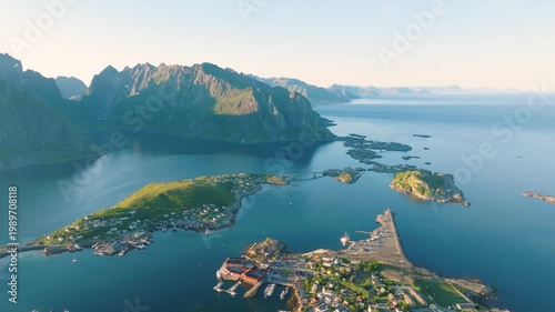 Aerial drone view of Reine, Lofoten islands, Norway. Scenic summer video with mountains, islands and ocean. A famous place. Travel and vacation in Scandinavia.