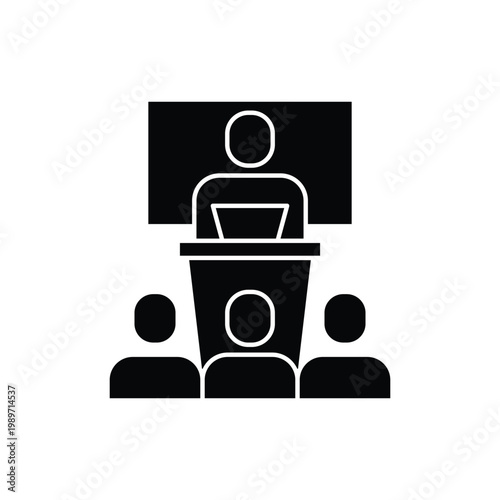 A black silhouette icon of a speaker at a podium addressing an audience with a screen in the background.