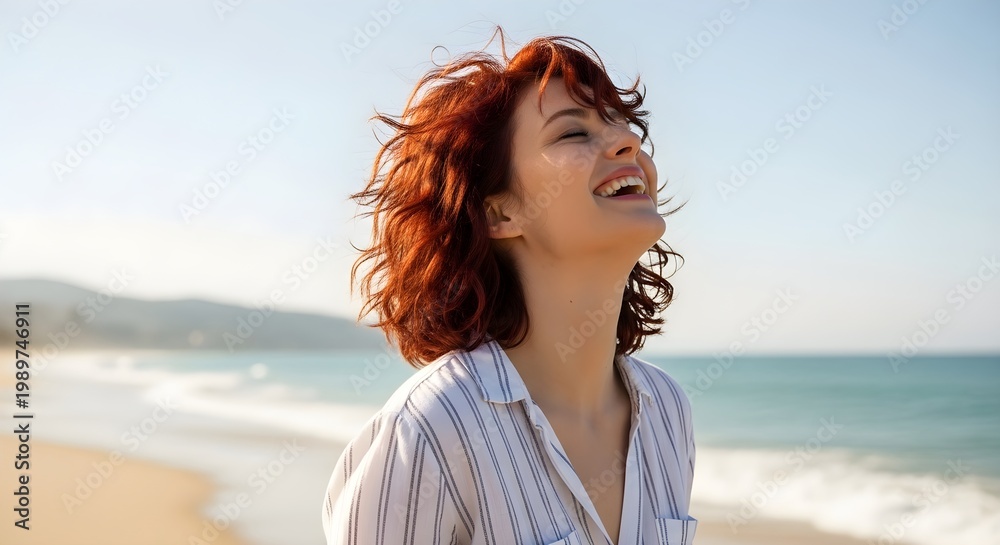 Obraz premium Beautiful Red-Haired Woman Laughing Joyfully With Her Head Thrown Back on a Sunny Beach
