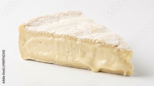 Creamy soft cheese wedge with white bloomy rind, artisan dairy product close-up, gourmet food ingredient for recipes isolated PNG with Transparent Background