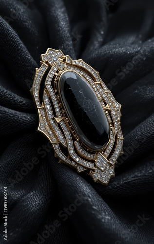 Elegant Art Deco style brooch with a large black oval gemstone surrounded by intricate diamond embellishments on a dark fabric background