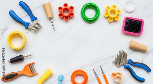 Various brightly colored grooming and crafting implements are arranged artfully on a white marble surface