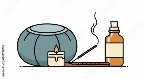 A serene spa setting features a candle, incense, and aromatherapy bottle on a table indoors.