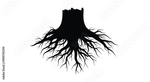 A stark black tree stump with exposed roots a dramatic silhouette
