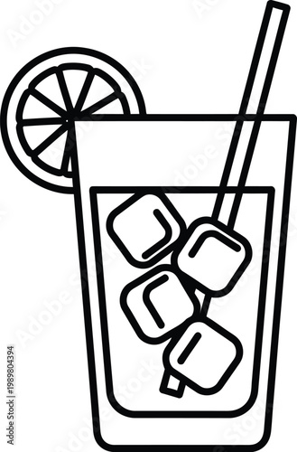 Refreshing drink with ice cubes and lemon slice in a tall glass with a straw