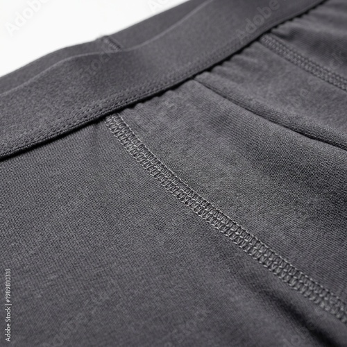 Close-up of Black Athletic Pants with Seam Detailing and Elastic Waistband