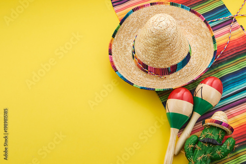 Mexican fiesta celebrating cinco de mayo with sombrero and maracas