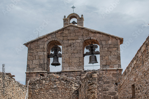 Bell tower with bells of the church of San Juan Bautista in Palazuelos, province of Guadalajara. Spain