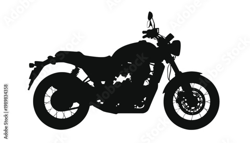 Motorcycle isolated in a sharp black silhouette against a clean white background displays the mechanical design of a classic cruiser bike for automotive industry marketing and design projects.