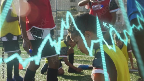 boy in yellow bib tipping bottle and drinking to rehydrate during sports break, waveform pulsing