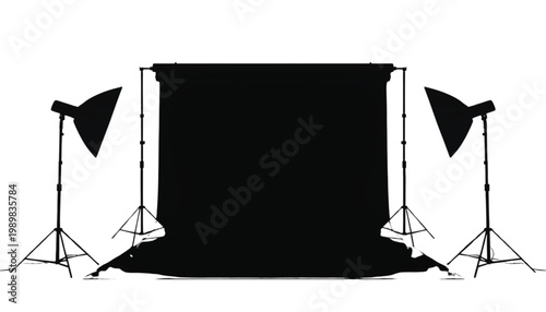Studio lighting setup featuring a professional backdrop and two softbox lights creates a perfect environment for high quality commercial photography sessions.