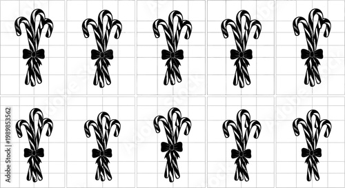 Set of elegant black fleur de lis designs with bows on grid paper background