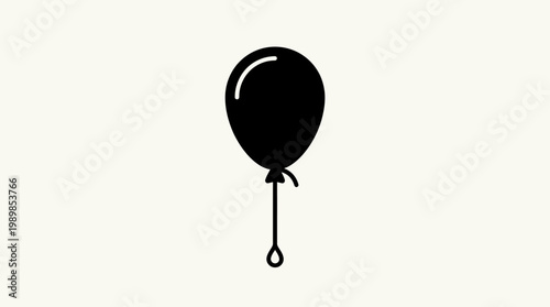  shows a single black balloon floating in air