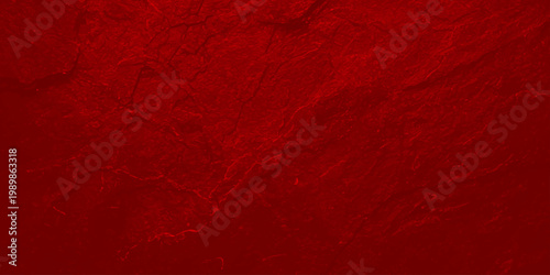 Vibrant red textured background with crimson color and rough stone like surface for design and decoration
