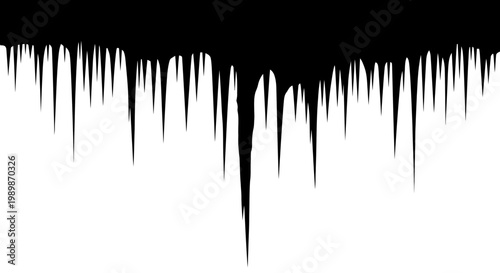 Sharp jagged black icicles dripping down against a stark white background creating a dramatic cold and abstract winter design element with varying lengths and sharp points