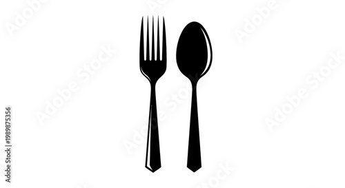 A black fork and spoon sit side by side on a table.