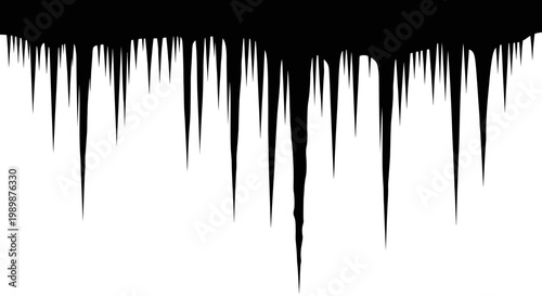 Sharp icicles hanging from a dark horizontal surface creating a jagged border effect against a stark white background symbolizing winter cold and frosty weather conditions