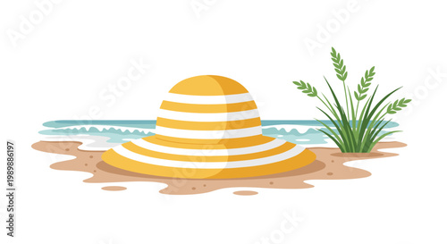 A vibrant yellow and white striped wide-brimmed sun hat sits prominently on a sandy beach shore near green coastal grass and gentle blue ocean waves.
