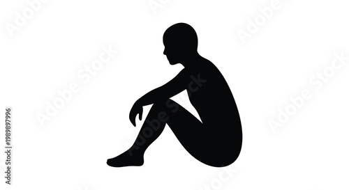 A solitary figure sits in contemplation a striking black silhouette