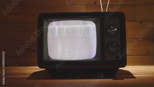 Vintage Television in living room with wooden background. 