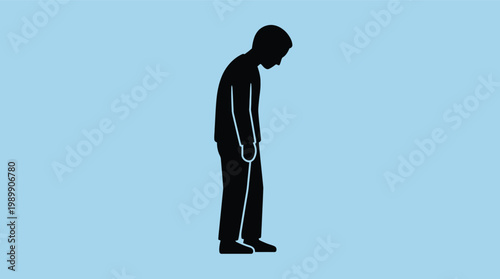 A man in a black silhouette stands dejectedly with his head bowed down
