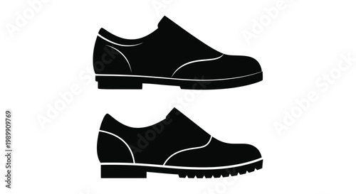 Black loafer shoes displayed in a striking minimalist silhouette