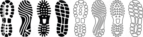 Collection of diverse black and white shoe sole imprint patterns isolated on a white background