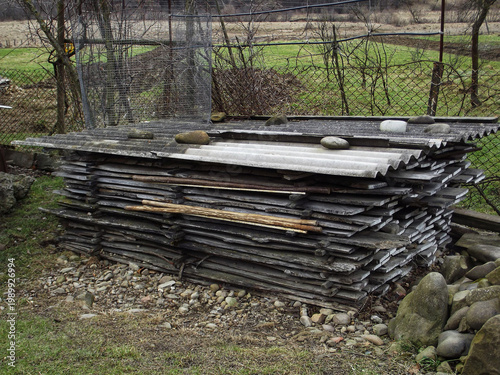 Natural air drying process of wooden planks at rural furniture factory