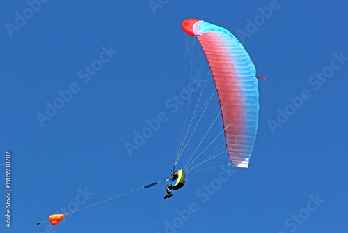 Paraglider being towed by a winch	