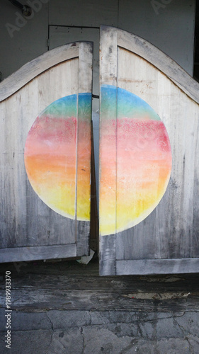 Rustic Wooden doors with colorful Circular Mural