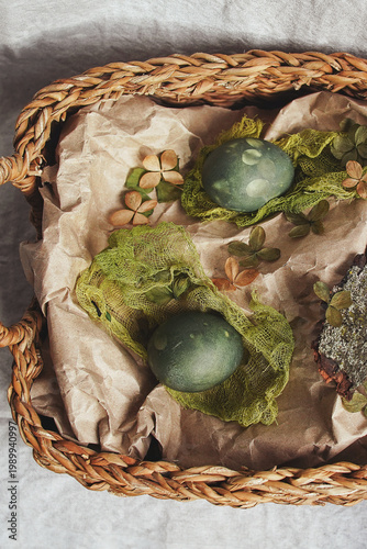 Naturally dyed botanical Easter eggs in a rustic woven basket  
