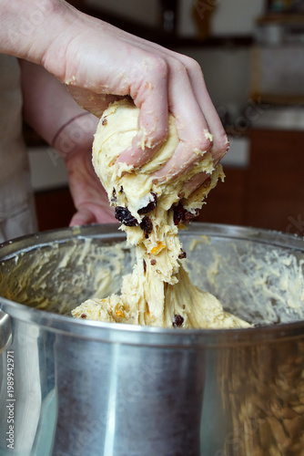 Stretching raw dough out of a pot