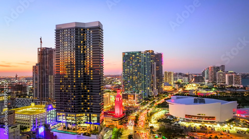 Stunning city skyline at sunset with illuminated skyscrapers